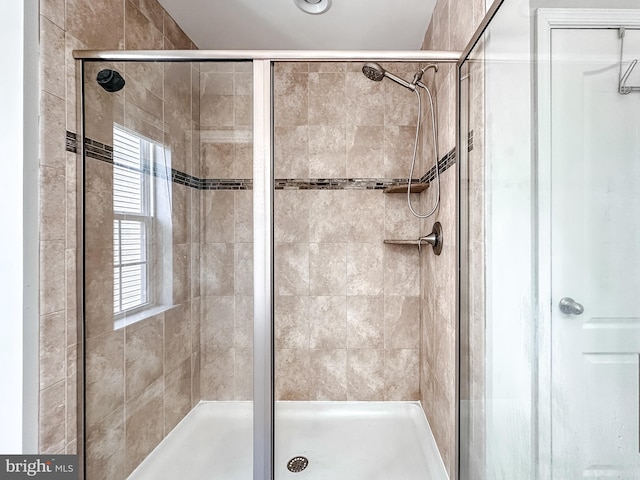 bathroom with a stall shower