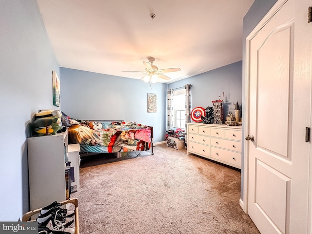 carpeted bedroom with a ceiling fan