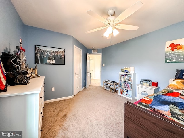 bedroom featuring a ceiling fan, light carpet, visible vents, and baseboards