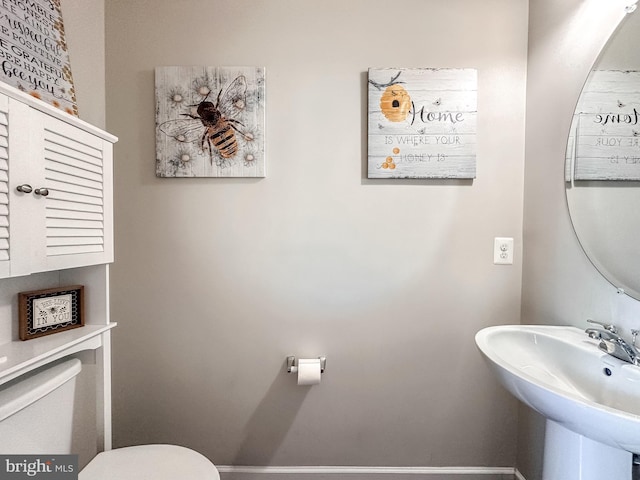 bathroom featuring a sink and toilet