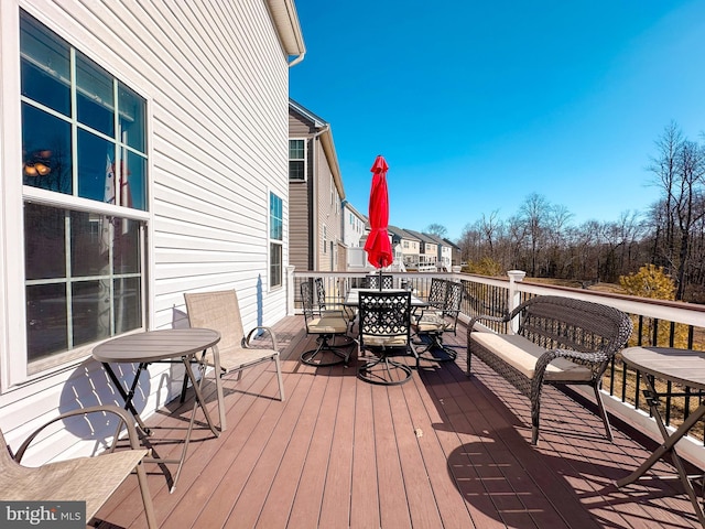 deck featuring outdoor dining area