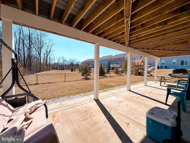 view of patio / terrace featuring a fenced backyard and a residential view