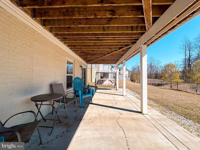 view of patio featuring fence