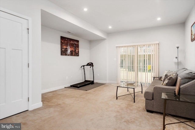 living room featuring recessed lighting, baseboards, and carpet floors