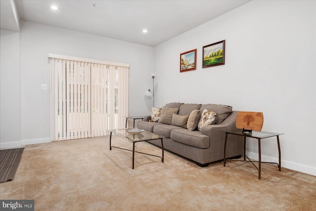 living room with recessed lighting, carpet, and baseboards