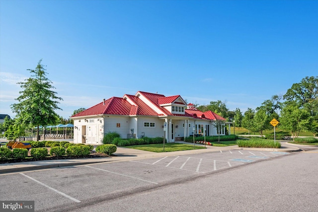 view of building exterior featuring uncovered parking