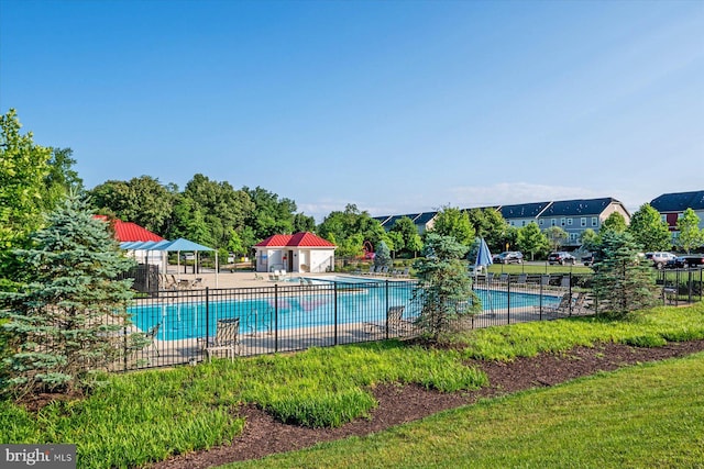 pool featuring a patio area and fence