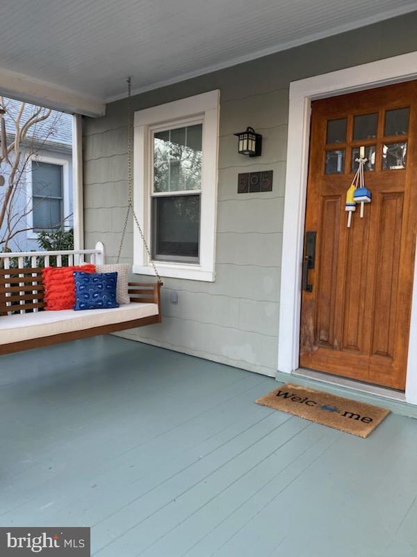 doorway to property featuring a porch