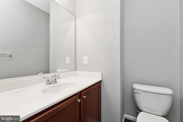 half bath with vanity and toilet