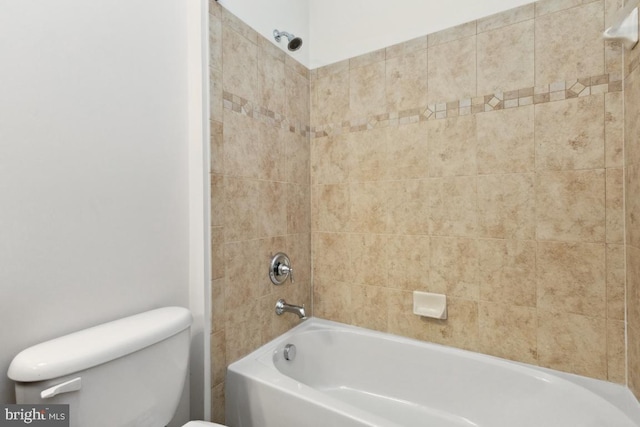 full bathroom featuring washtub / shower combination and toilet