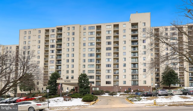 view of property featuring uncovered parking