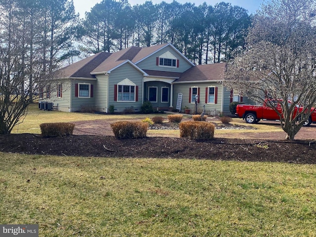 view of front of property featuring a front lawn and central air condition unit