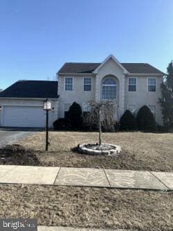 view of front of house featuring driveway and an attached garage