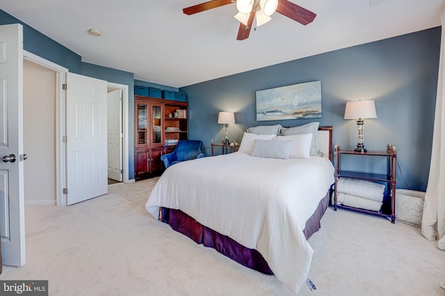 bedroom featuring ceiling fan, baseboards, and carpet flooring