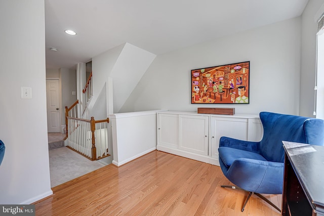 sitting room featuring light wood-type flooring, baseboards, and recessed lighting