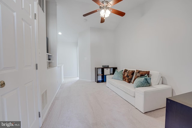 living area with baseboards, a ceiling fan, visible vents, and light colored carpet