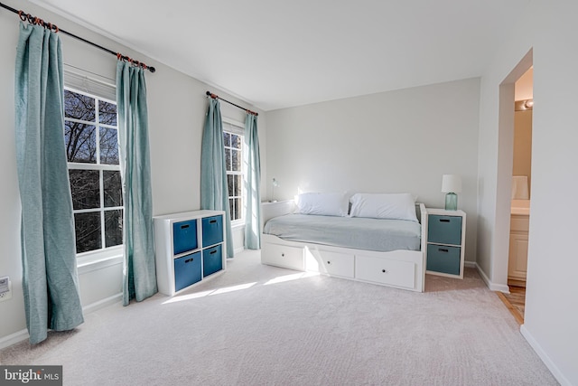 bedroom with carpet floors and baseboards