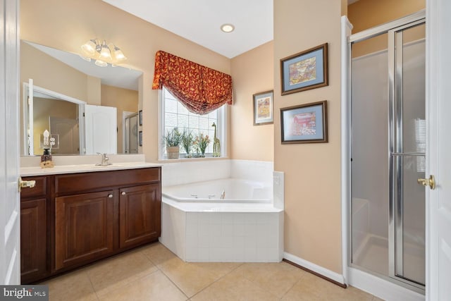 full bathroom featuring a stall shower, baseboards, tile patterned floors, vanity, and a bath