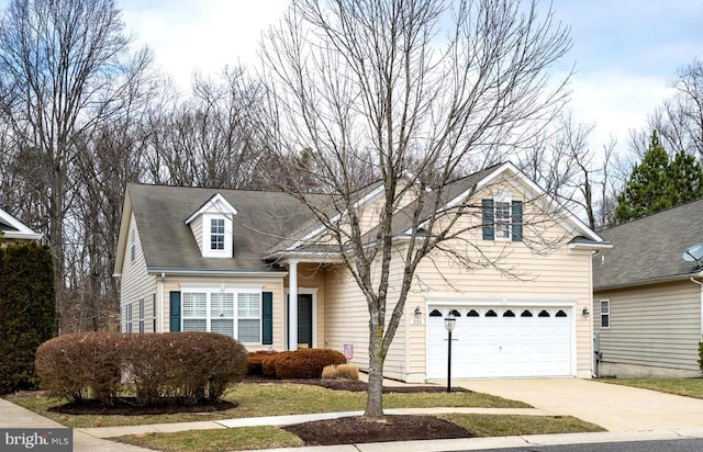 traditional-style house with a garage and driveway