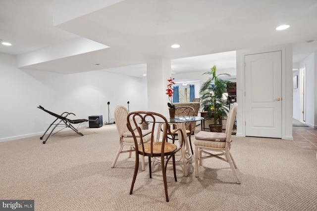 dining area with light carpet, baseboards, and recessed lighting