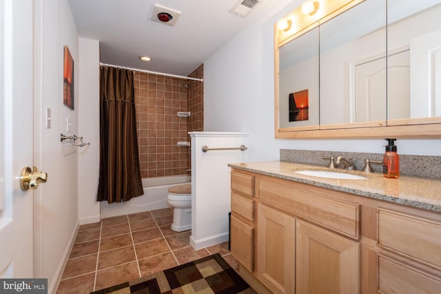 bathroom featuring tile patterned flooring, toilet, vanity, visible vents, and shower / bath combo