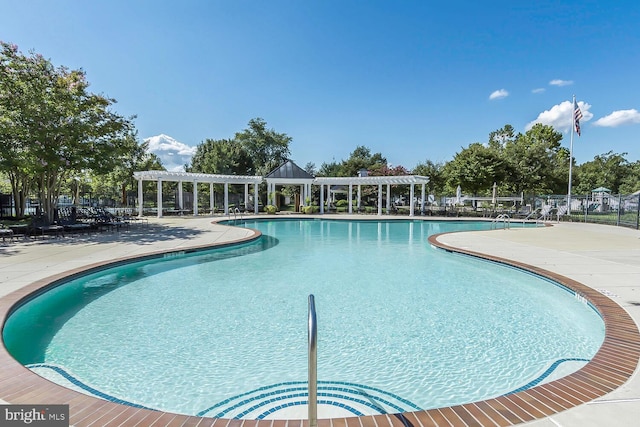 community pool with fence, a patio, and a pergola