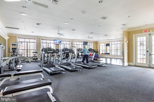 workout area with visible vents, ornamental molding, and ceiling fan