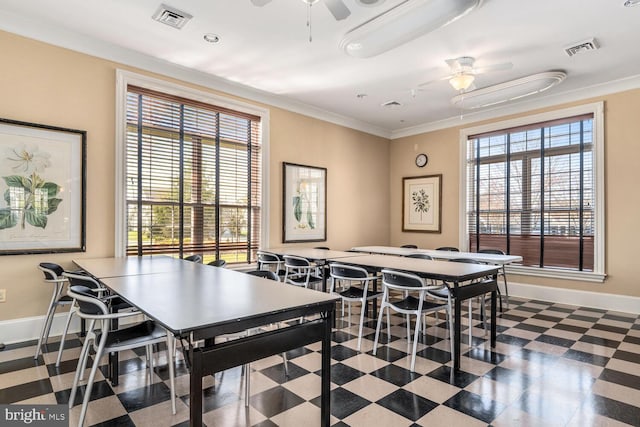 game room with baseboards, a ceiling fan, visible vents, and crown molding