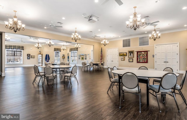 dining room featuring plenty of natural light, visible vents, ornamental molding, and ceiling fan with notable chandelier