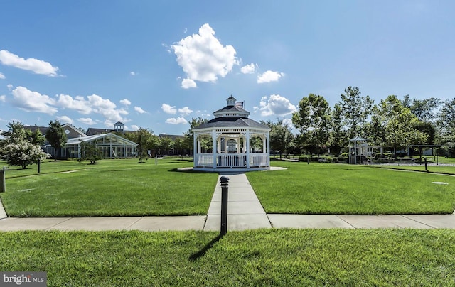 surrounding community with a gazebo and a lawn