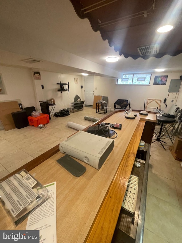 recreation room featuring visible vents and tile patterned flooring