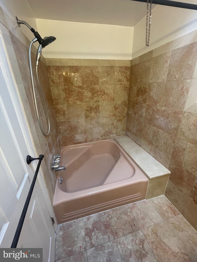 bathroom with shower / tub combination