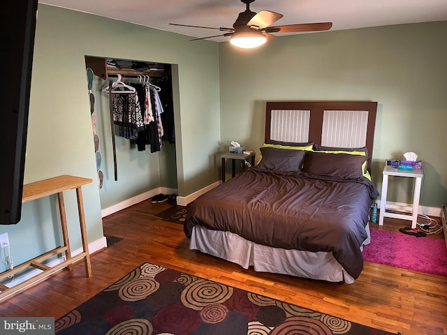 bedroom featuring ceiling fan, wood finished floors, and baseboards