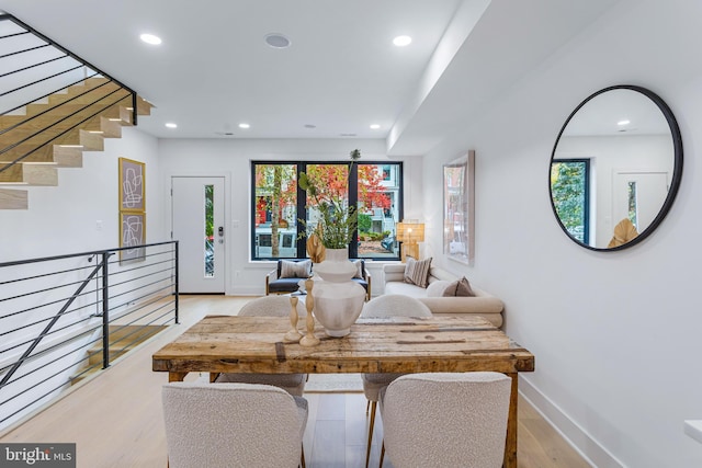 interior space featuring recessed lighting, baseboards, and wood finished floors