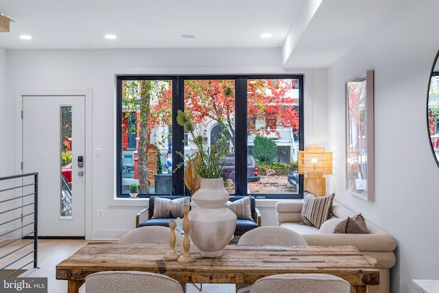 sitting room with light wood-type flooring, a wealth of natural light, and recessed lighting