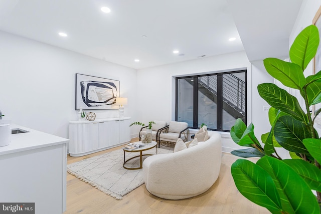 living room with recessed lighting and wood finished floors