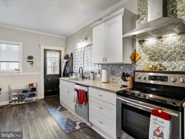 kitchen with dishwashing machine, dark wood-type flooring, a sink, wall chimney range hood, and stainless steel range with electric stovetop