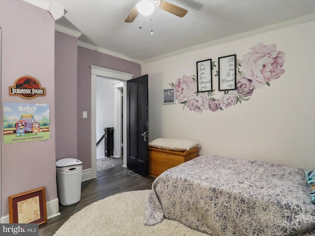 bedroom with crown molding, baseboards, ceiling fan, and dark wood-style flooring