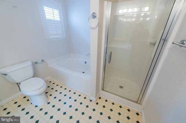 full bathroom featuring a garden tub, toilet, baseboards, a shower stall, and tile patterned floors