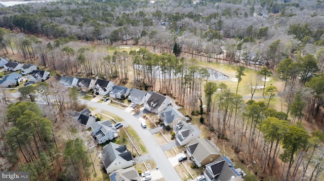 birds eye view of property with a residential view and a forest view