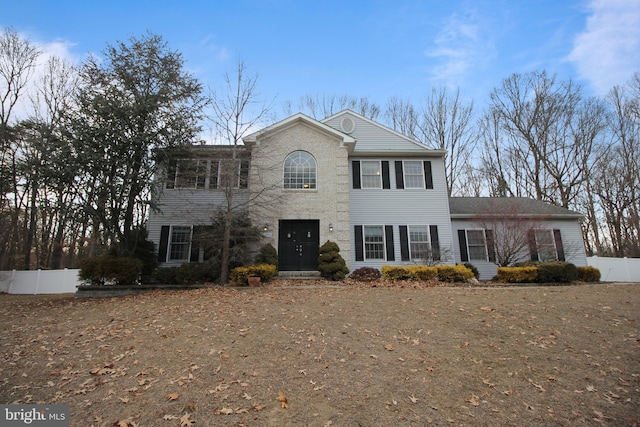 colonial house with fence