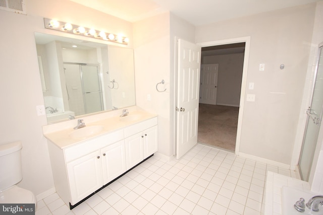 full bathroom with a stall shower, visible vents, a sink, and toilet