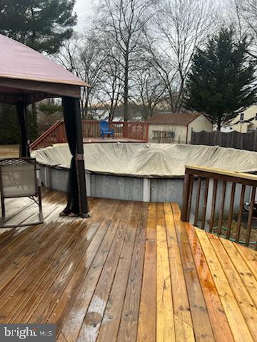 wooden deck featuring a gazebo