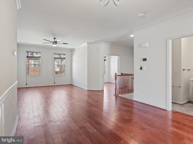 unfurnished living room featuring wood finished floors, a ceiling fan, and crown molding