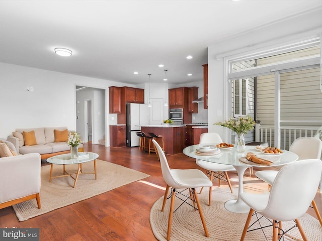 dining area featuring recessed lighting and dark wood finished floors