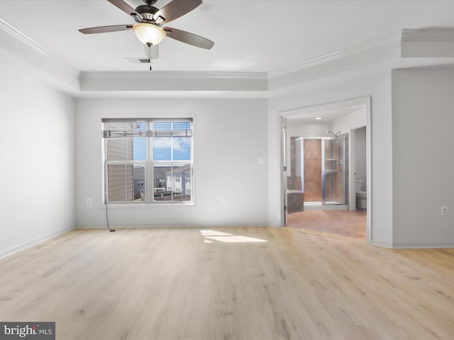 empty room featuring ceiling fan, visible vents, crown molding, and wood finished floors