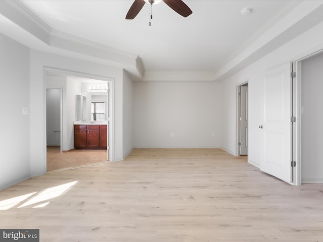 unfurnished bedroom with light wood-style flooring, ornamental molding, ceiling fan, and connected bathroom