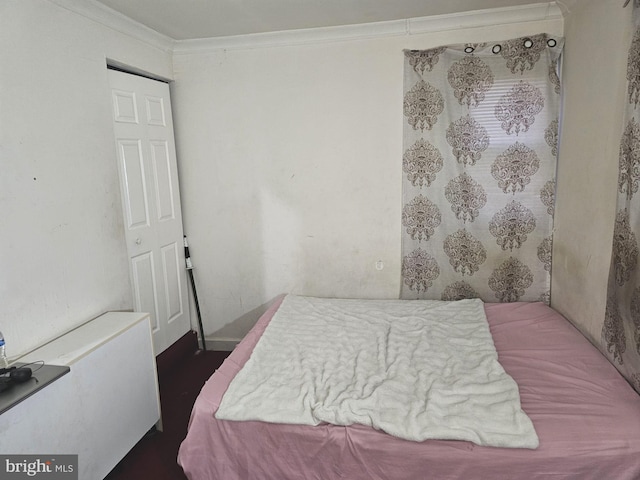 bedroom featuring crown molding