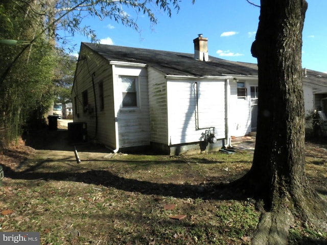 exterior space featuring a chimney