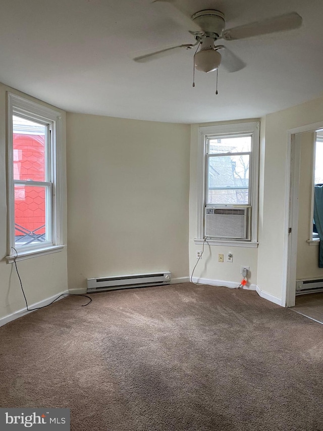 unfurnished room featuring a baseboard radiator, a healthy amount of sunlight, cooling unit, and carpet